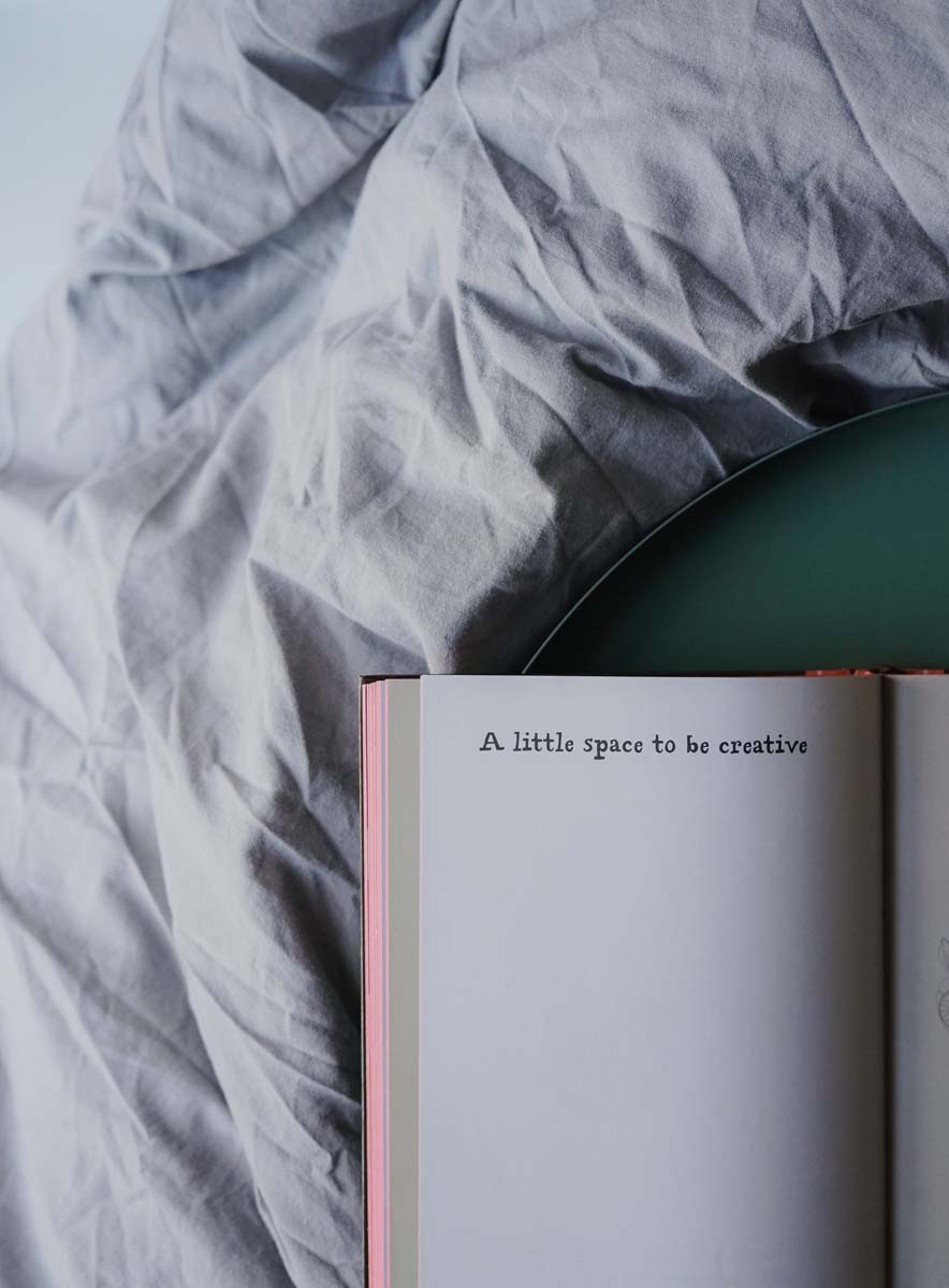 An open notebook on a tray — a little space to be creative